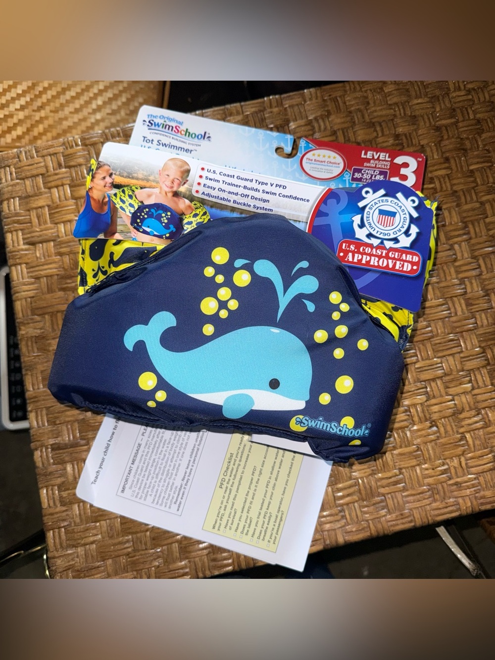 SwimSchool U.S. Coast Guard Approved Tot Swimmer in a navy blue whale design